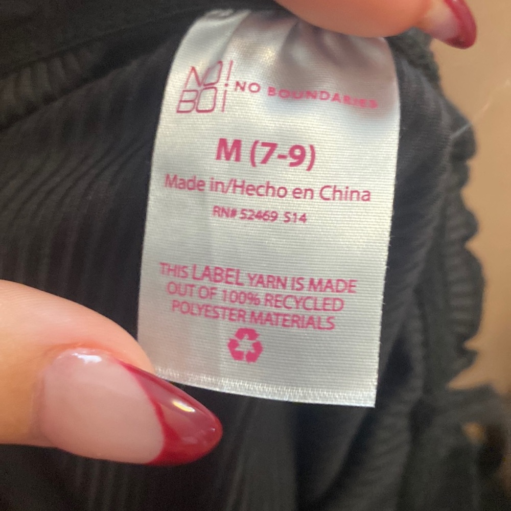 Women’s black tank with ruffle neckline and bottom brown buttons down front